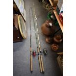 Three fishing rods with two reels. (A/F)