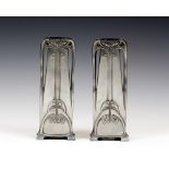 A pair of W.M.F polished pewter vases, of tapering rectangular form with stylised Art Nouveau long