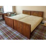 A rare pair of 1930s Art Deco oak single beds, the angular head and foot boards with bold reeded