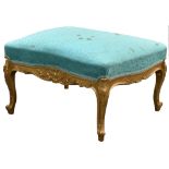 A large 19th century carved beechwood gilt stool, the serpentine seat in deep turquoise silk damask,