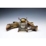 A Victorian deer hoof & horn cut glass inkstand, the cut glass bottle with brass lid sitting upon