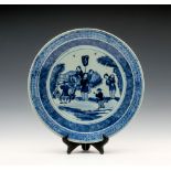 A Chinese blue and white porcelain charger, 19th century, robustly potted, the well painted with