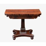 A late Regency D-shaped foldover mahogany card table, the well-figured top over a plain frieze