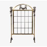 A gilt brass and leaded glass fire screen, early 20th century, with bronze floral swagged mounts,