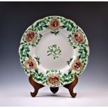 A large Edwardian Royal Worcester Vitreous Christmas plate, the centre with a sprig of mistletoe and