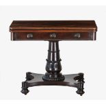 A late Regency mahogany fold over tea table, the rounded rectangular top over a frieze with