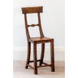 A late 18th century child's stained ash and elm correction chair, the deep bar top rail on swept