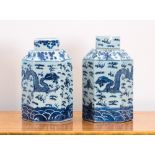 A matched pair of Chinese blue and white porcelain hexagonal canisters with lids, decorated with