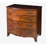 An early 19th century bowfront chest of drawers, the boxwood strung top over four conforming