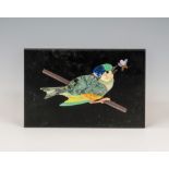 A 19th century Italian grand tour pietra dura plaque of a bird, the black slate inlaid in coloured