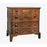 A Charles II oak two part chest of drawers, the moulded top over four long drawers, the fronts