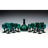 A collection of Victorian Bristol Green wine glasses and a decanter, including a set of nine glasses