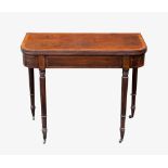 A Regency D-shaped foldover cross banded mahogany tea table, the well figured top cross banded in