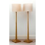 A pair of pale sycamore Art Deco standard lamps, 1930s, the slender, square tapered columns on