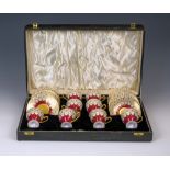 A cased set of eight Royal Worcester for Asprey demitasse coffee cups and saucers, with puce printed