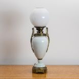 A Victorian opaline glass and gilt brass two handled vase oil lamp, converted to electricity, with