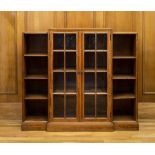 An Art Deco walnut part glazed breakfront bookcase by Heal & Son Ltd., c.1930, with 'H. & Son