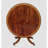 A fine rosewood and parcel gilt tilt-top breakfast or centre table, the beautifully figured top with