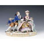 A large Continental porcelain figural group, probably German, early 20th century, of a Gallant and