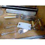 A collection of silver serving implements to include knife rests and bread knife (9)