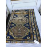 A small Kuba rug early 20th century, the row of three joined octagonal medallions in buff, light