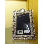 A Victorian style silver photo frame with easel back