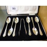 A cased set of Harrods Art Deco silver teaspoons with sugar tongs (Richard Woodman Burbridge) London