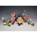 A collection of Boehm fine porcelain flowers, to include two centrepieces ' Peace Rose with Apple