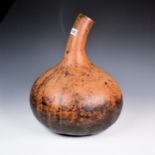 A large African gourd vase.