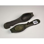 An 18th century bronze spoon mould, the two section mould with spoon indents and two casting logs.