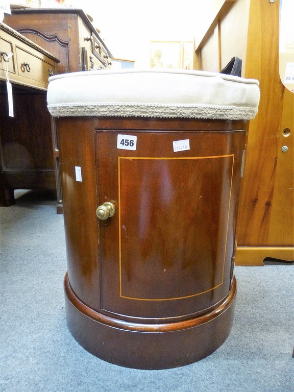 A inlaid mahogony drum stool with storage.