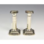 A pair of silver George V column candlesticks, Harrods Stores Ltd (Richard Burbridge), Sheffield,