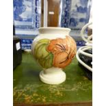 A vintage 1950's Moorcroft vaseCoral Hibiscus pattern on ivory ground of baluster form, 3«in. (9cm.)