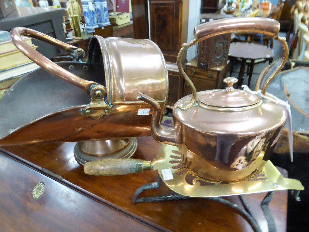 A 19th century brass & iron trivet, copper coal scuttle & copper kettle (3)