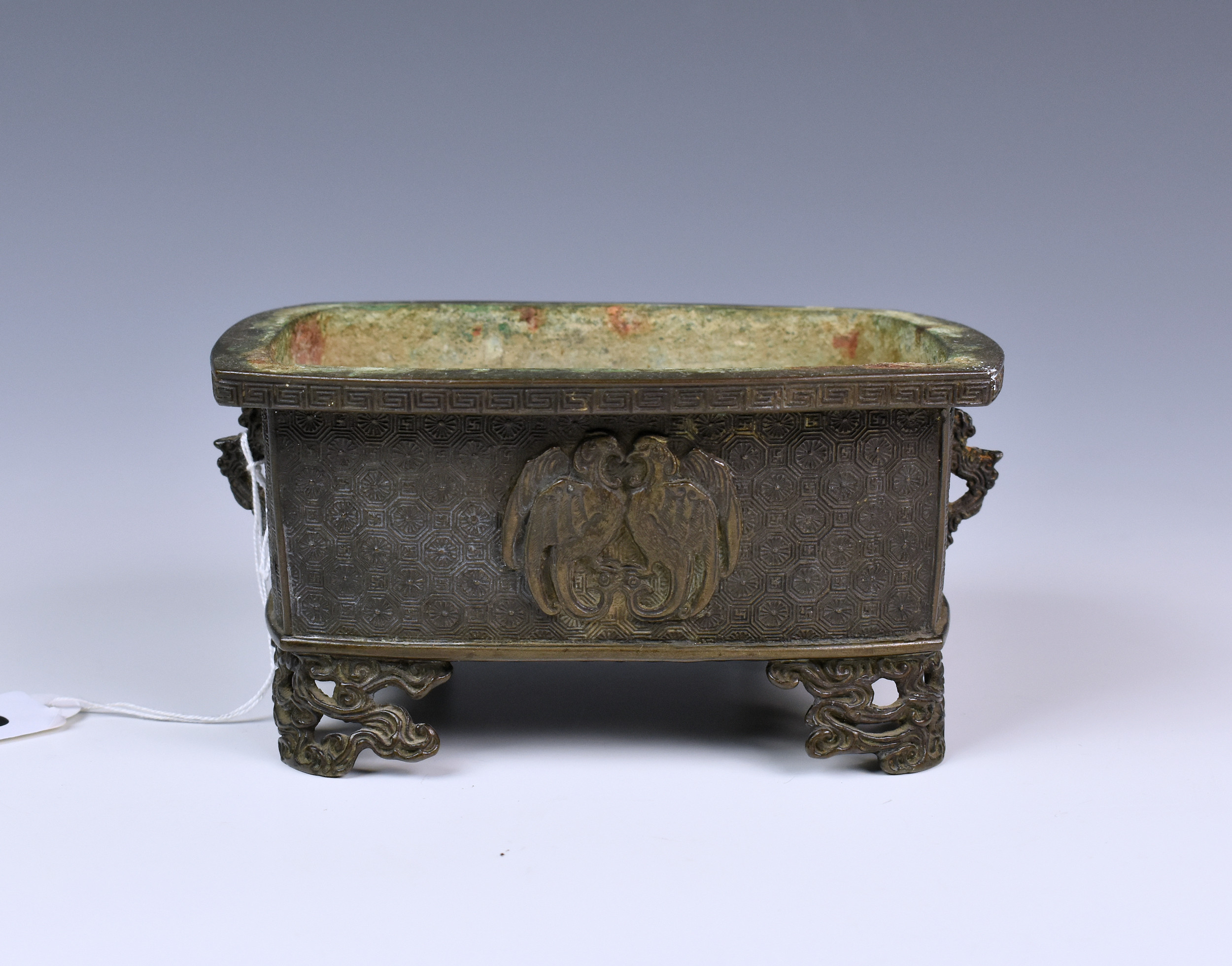 A Chinese bronze patinated white metal censer, late 19th / early 20th century, with diaper ground