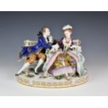 A large Continental porcelain figural group, probably German, early 20th century, of a Gallant and