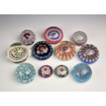 A collection of eleven millefiori glass paperweights, of varying sizes and dates. (11)