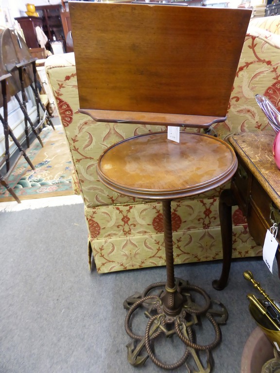 A Victorian cast iron, brass and red walnut adjustable reading standthe bookrest on an adjustable