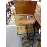 A Victorian cast iron, brass and red walnut adjustable reading standthe bookrest on an adjustable