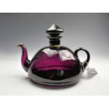 A Victorian Amethyst glass teapot.