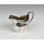 A George III silver cream jug, William Bateman I, London, 1815, of oval form with bright cut