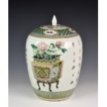 A Chinese Famille Verte ginger jar & matched cover, probably 19th century, of typical ovid form,