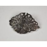 A late Victorian silver nurses buckle, Britton, Gould & Co, Birmingham, 1898, of pierced scroll