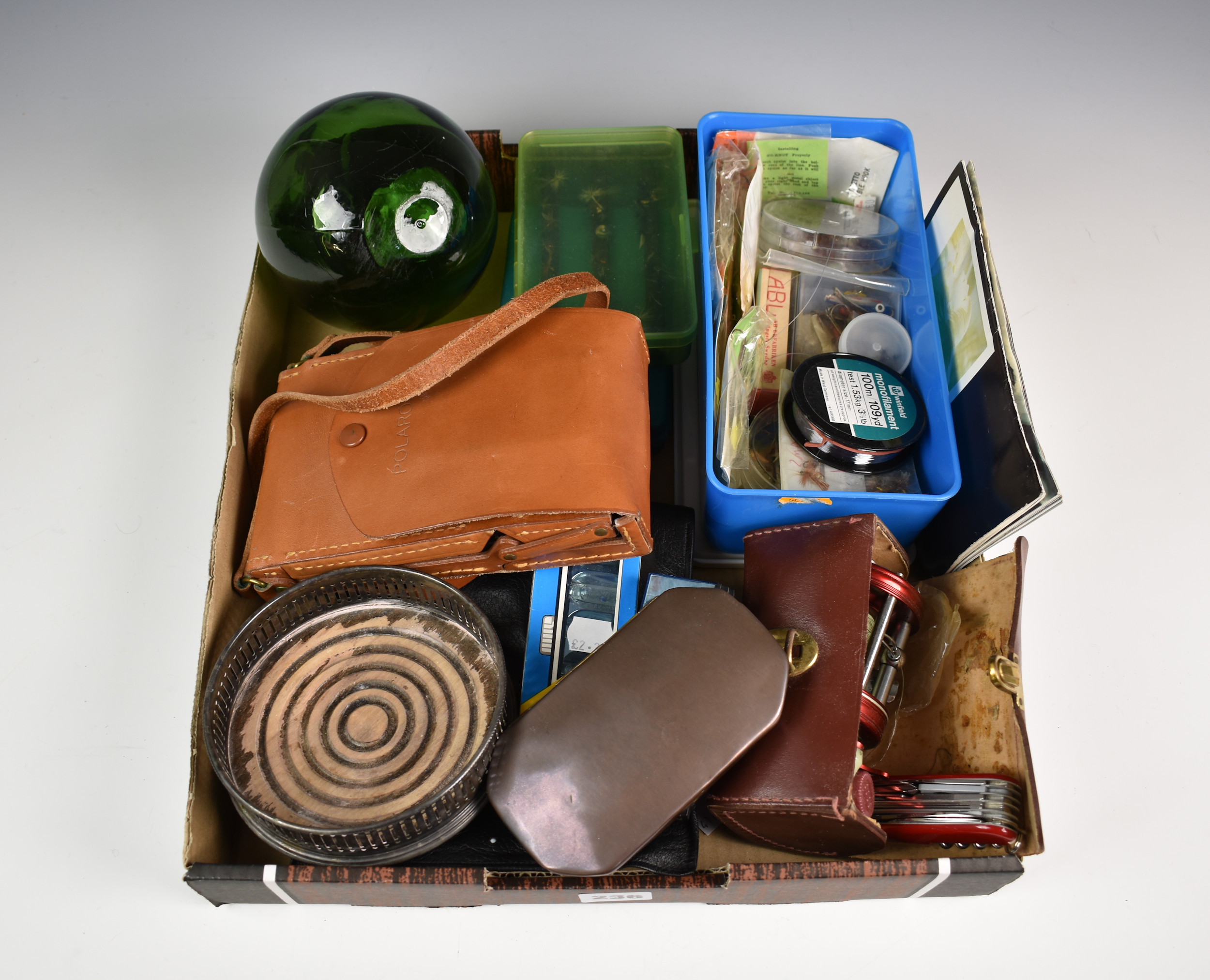 A rummage box, to include fishing reel, flies and accessories; green glass fishing float; Swiss Army