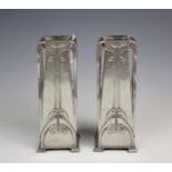 A pair of W.M.F polished pewter vases, of tapering rectangular form with stylised Art Nouveau long