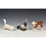 A Beswick pigeon model No. 13833; together with Beswick Hereford calf model 854 & a Doulton stalking