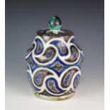 A Iznik style pottery pot & cover, possibly late 19th century, 11¬in. (28.5cm.) high.