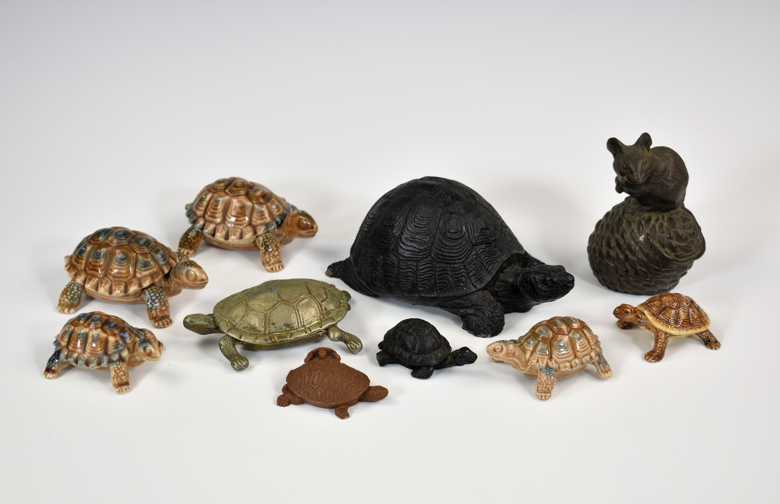 A collection of Wade tortoises, together with various other tortoises, one made from coal & a