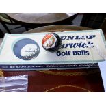 A box of twelve vintage Dunlop Warwick golf balls + a Dunlop 65 number 8. All still wrapped.