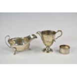 A silver sauce boat, Thomas Turner, Sheffield, 1939; together with a silver cream jug, William Neale